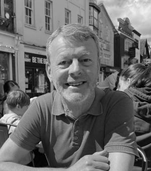 A photo of me outside of a cafe in Wiltshire, UK